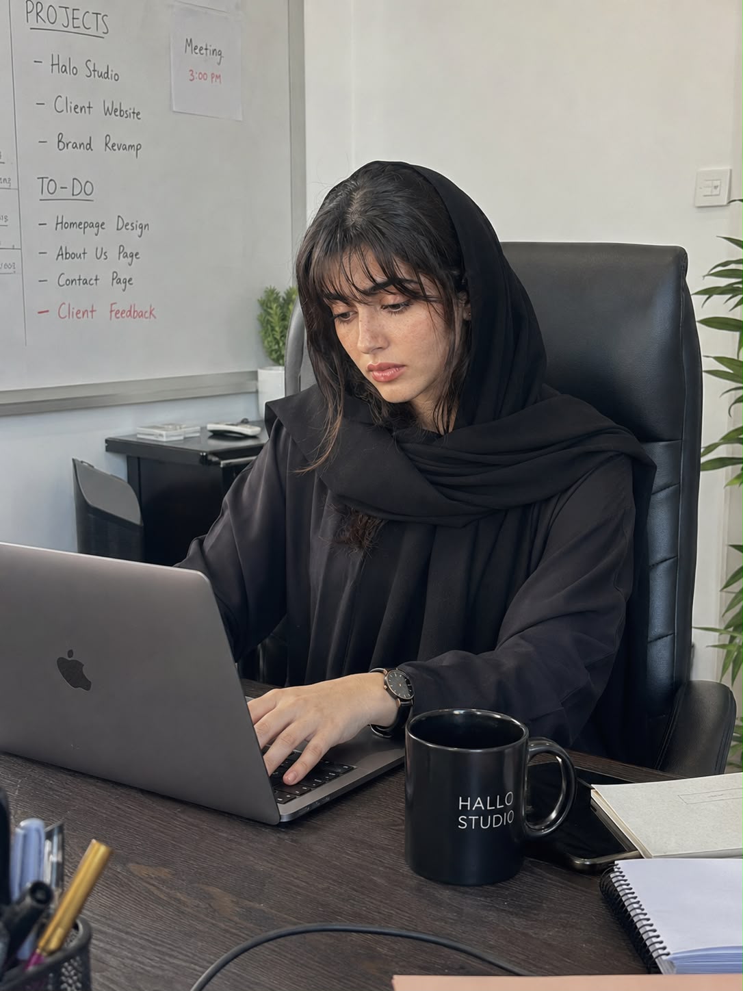 Iqra Khan, founder of Hallo Studio, at her desk